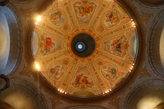 the ceiling of a church with a painted dome