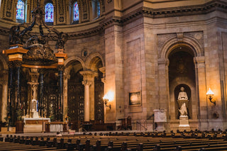 A church with pews and stained glass windows