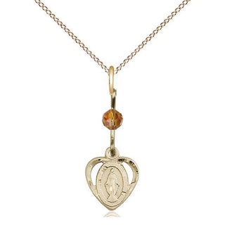 14kt Gold Miraculous Medal with a Topaz bead