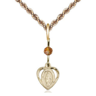 14kt Gold Miraculous Medal with a Topaz bead