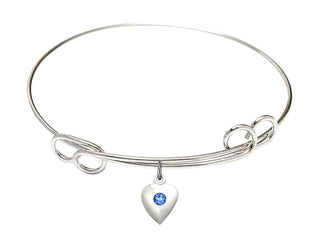 7 1/2 inch Round Double Loop Rhodium Bangle Bracelet with a Sterling Silver Heart charm.