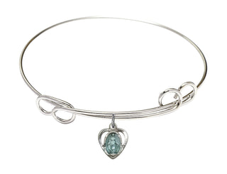 7 1/2 inch Round Double Loop Rhodium Bangle Bracelet with a Sterling Silver Miraculous Heart charm.
