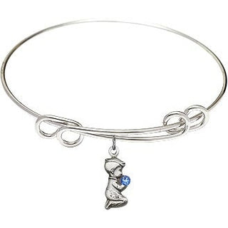 8 1/2 inch Round Double Loop Rhodium Bangle Bracelet with a Sterling Silver Praying Boy charm.