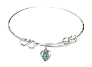 8 1/2 inch Round Double Loop Rhodium Bangle Bracelet with a Sterling Silver Miraculous Heart charm.