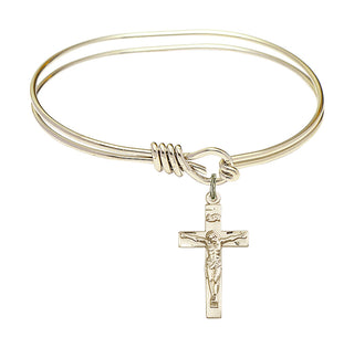 5 3/4 inch Oval Eye Hook Hamilton Gold Bangle Bracelet with a 14kt Gold Filled Crucifix charm.