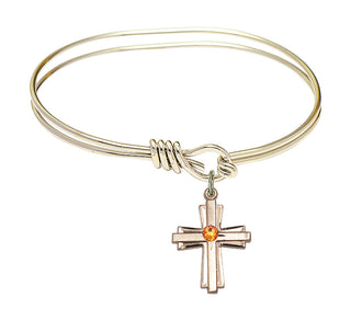 5 3/4 inch Oval Eye Hook Hamilton Gold Bangle Bracelet with a 14kt Gold Filled Cross charm.