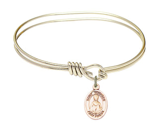 5 3/4 inch Oval Eye Hook Hamilton Gold Bangle Bracelet with a 14kt Gold Filled Saint Winifred of Wales charm. Engraved Catholic Saint Jewelry
