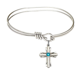 5 3/4 inch Oval Eye Hook Rhodium Bangle Bracelet with a Sterling Silver Cross charm.