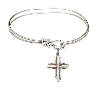 5 3/4 inch Oval Eye Hook Rhodium Bangle Bracelet with a Sterling Silver Cross charm.