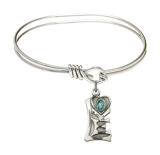 5 3/4 inch Oval Eye Hook Rhodium Bangle Bracelet with a Sterling Silver Miraculous charm.