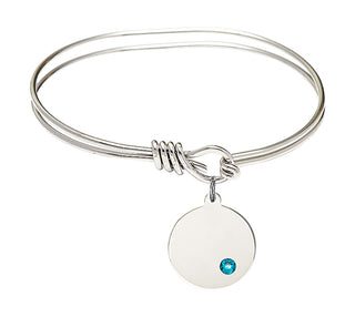 5 3/4 inch Oval Eye Hook Rhodium Bangle Bracelet with a Sterling Silver Plain Disc charm.