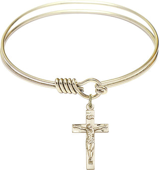 Bangle Bracelet with a Crucifix charm.