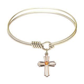 6 1/4 inch Round Eye Hook Hamilton Gold Bangle Bracelet with a 14kt Gold Filled Cross charm.