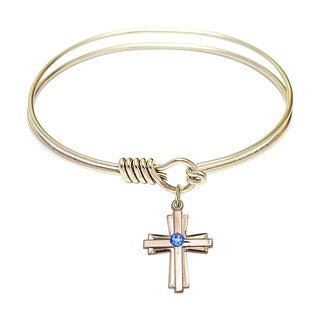 6 1/4 inch Round Eye Hook Hamilton Gold Bangle Bracelet with a 14kt Gold Filled Cross charm.