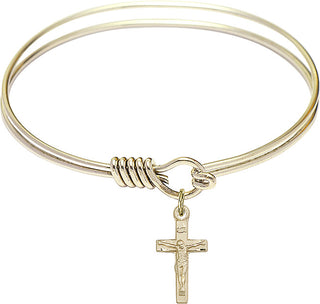 Bangle Bracelet with a Crucifix charm.