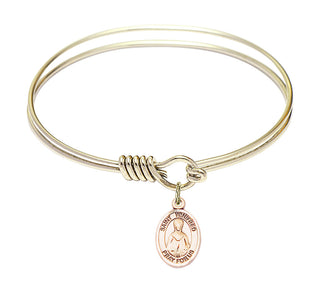 6 1/4 inch Round Eye Hook Hamilton Gold Bangle Bracelet with a 14kt Gold Filled Saint Winifred of Wales charm. Engraved Catholic Saint Jewelry
