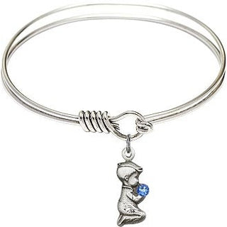 6 1/4 inch Round Eye Hook Rhodium Bangle Bracelet with a Sterling Silver Praying Boy charm.