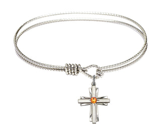 6 1/4 inch Oval Eye Hook Rhodium Bangle Bracelet with a Sterling Silver Cross charm.