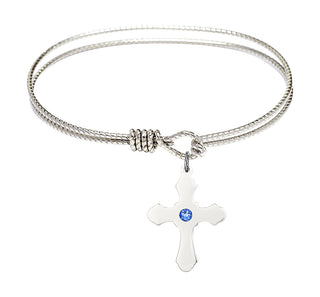 6 1/4 inch Oval Eye Hook Rhodium Bangle Bracelet with a Sterling Silver Cross charm.