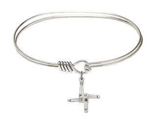 7 inch Oval Eye Hook Rhodium Bangle Bracelet with a Sterling Silver Saint Brigid Cross charm.