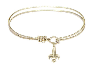 7 1/4 inch Oval Eye Hook Hamilton Gold Bangle Bracelet with a 14kt Gold Filled Fleur de Lis charm.