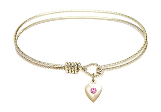 7 1/4 inch Oval Eye Hook Hamilton Gold Bangle Bracelet with a 14kt Gold Filled Heart charm.