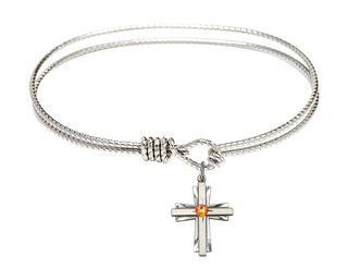 7 1/4 inch Oval Eye Hook Rhodium Bangle Bracelet with a Sterling Silver Cross charm.