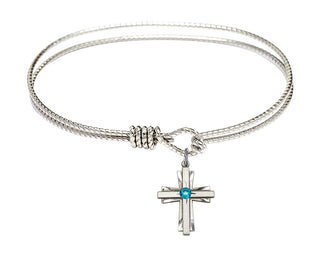 7 1/4 inch Oval Eye Hook Rhodium Bangle Bracelet with a Sterling Silver Cross charm.