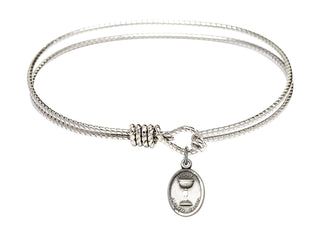 7 1/4 inch Oval Eye Hook Rhodium Bangle Bracelet with a Sterling Silver Holy Communion charm.