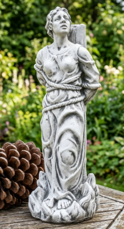 Statue of Saint Joan of Arc bound at the stake, gaze lifted upward — detail view