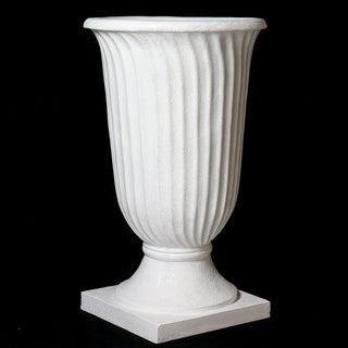 Fluted urn planter with tapered body and pedestal base, shown in a fiberglass resin finish. — alternate view