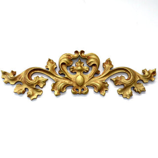 Horizontal fiberglass resin wall carving with a low-relief architectural design. — alternate view