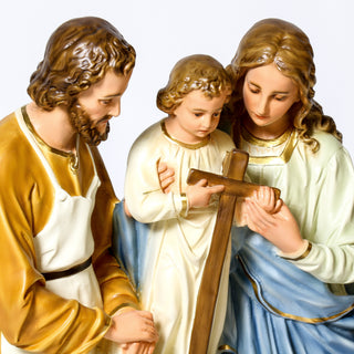 Hand-painted statue of the Holy Family, Joseph, Mary, and the infant Jesus, in realistic color — detail view