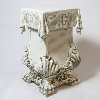 Fiberglass resin pedestal with a draped column design resting on a claw-shaped foot — alternate view