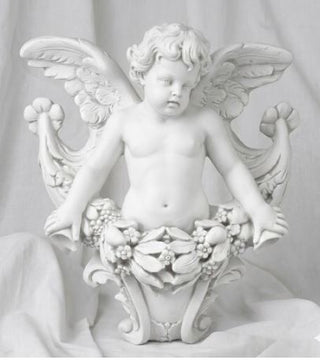 Wall piece of an angel gliding with wings spread, head turned to the left. — detail view