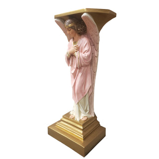 Hand-painted fiberglass resin angel resting beside a tall cross on a pedestal base