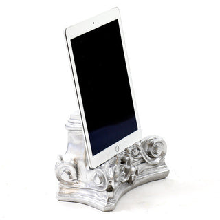 Fluted architectural capital pedestal used as a display base for statues or urns. — alternate view