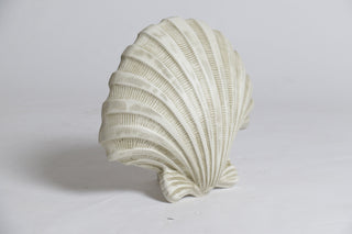 A wall sconce shaped like a ridged shell, 12 inches tall, in fiberglass resin. — alternate view