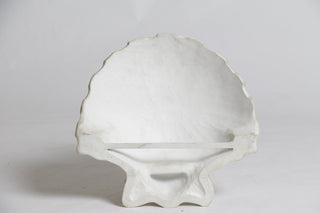 A wall sconce shaped like a ridged shell, 12 inches tall, in fiberglass resin. — alternate view