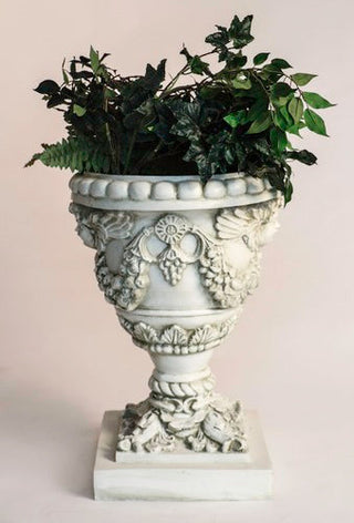 Fiberglass resin planter with an angel motif, 24 inches high, shown in a neutral finish. — alternate view