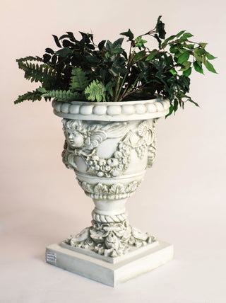 Fiberglass resin planter with an angel motif, 24 inches high, shown in a neutral finish. — alternate view