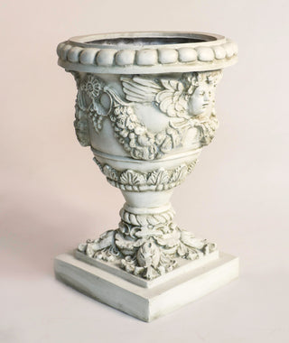 Fiberglass resin planter with an angel motif, 24 inches high, shown in a neutral finish. — alternate view