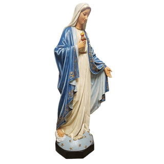 Tall hand-painted statue of the Blessed Mother with one hand outstretched, standing outdoors. — alternate view