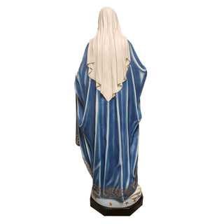 Tall hand-painted statue of the Blessed Mother with one hand outstretched, standing outdoors. — alternate view