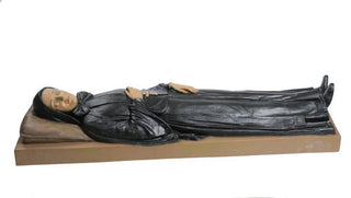 Hand-painted statue of Mother Cabrini shown reclining in a restful pose — alternate view
