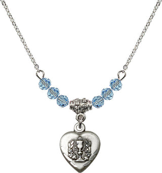 18" Rhodium Plated Necklace with 4mm Aqua Crystal Beads featuring a Sterling Silver Heart / Communion Medal.