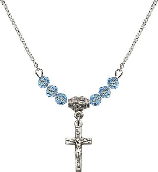 18" Rhodium Plated Necklace with 4mm Aqua Crystal Beads featuring a Sterling Silver Crucifix Medal.
