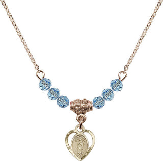 18" Hamilton Gold Plated Necklace with 4mm Aqua Crystal Beads featuring a 14kt Gold Filled Our Lady of Guadalupe Medal.