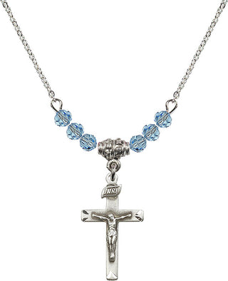 18" Rhodium Plated Necklace with 4mm Aqua Crystal Beads featuring a Sterling Silver Crucifix Medal.
