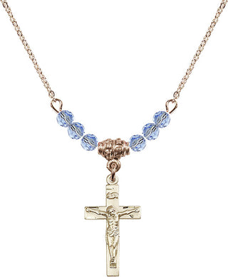 18" Hamilton Gold Plated Necklace with 4mm Light Sapphire Crystal Beads featuring a 14kt Gold Filled Crucifix Medal.